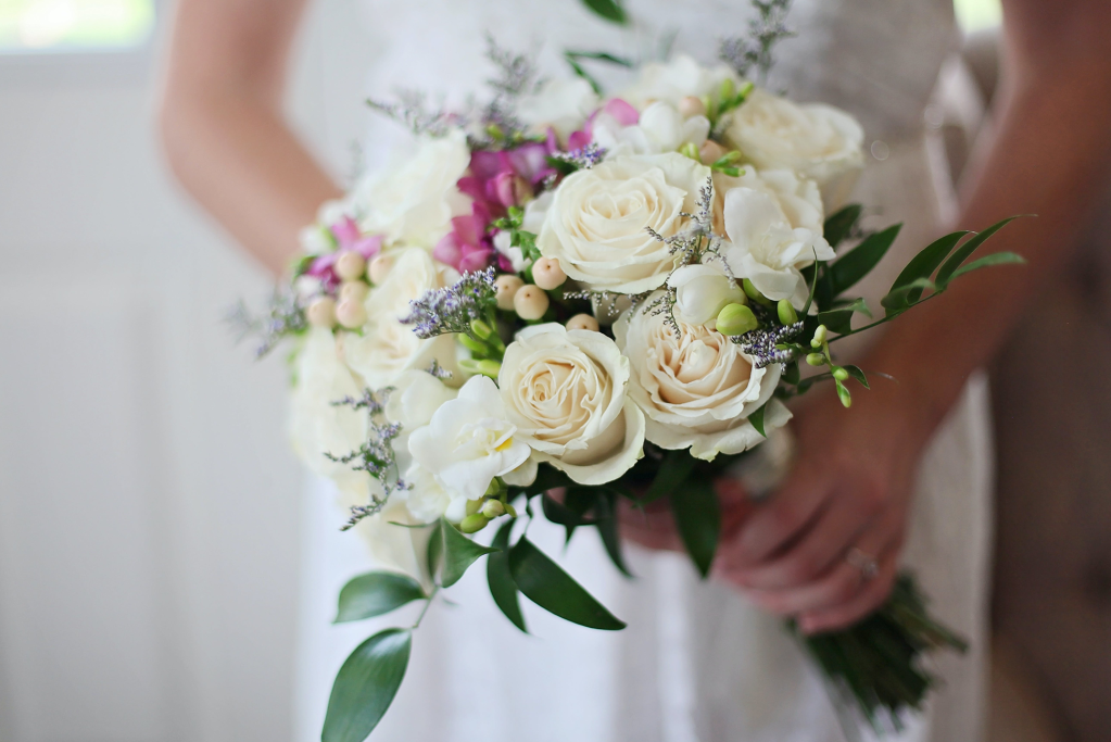 bride holding flowers